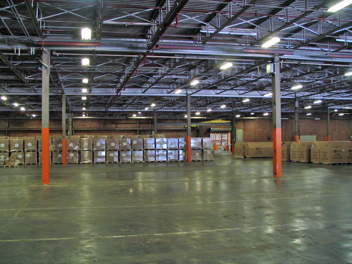Interior of Rivermill warehouse facility showing organized storage and pallets